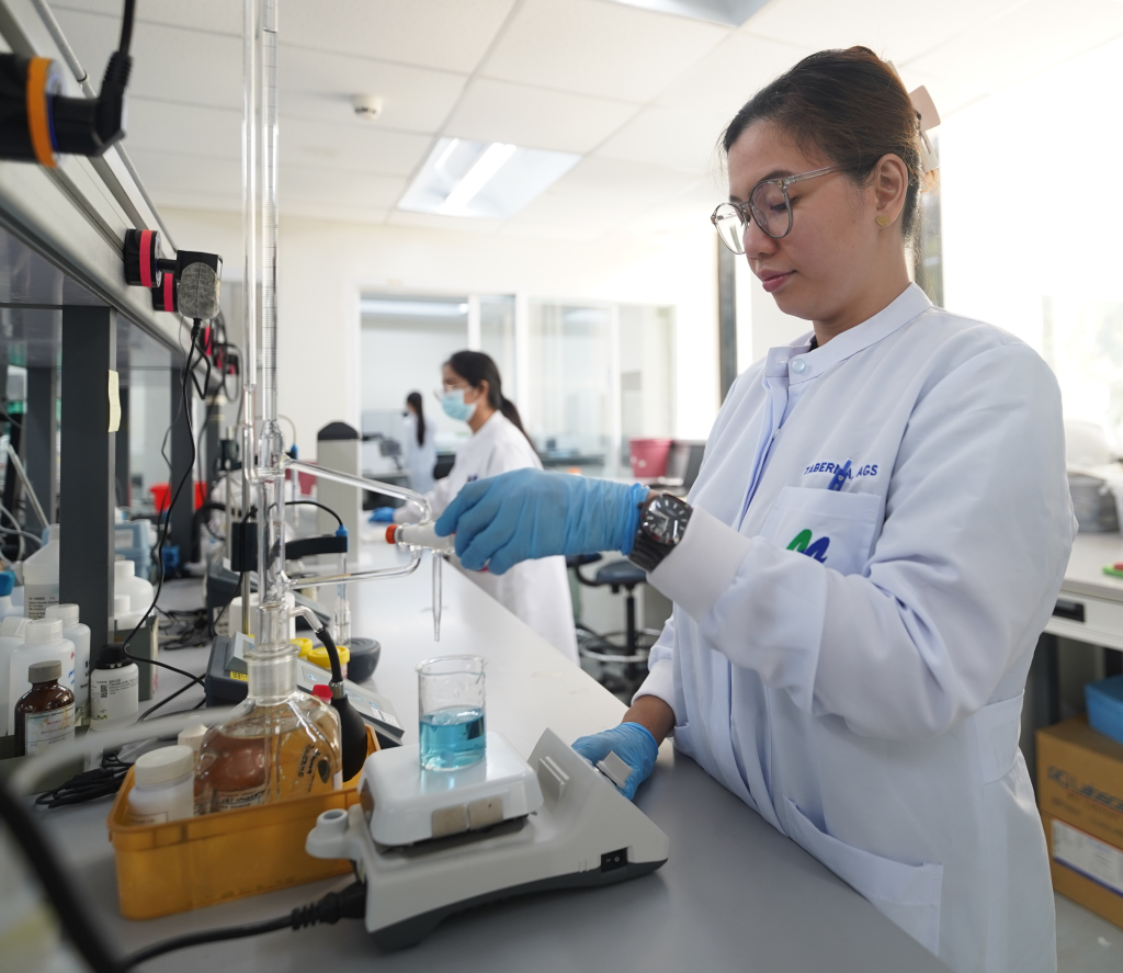 A medical laboratory technician reviewing test results